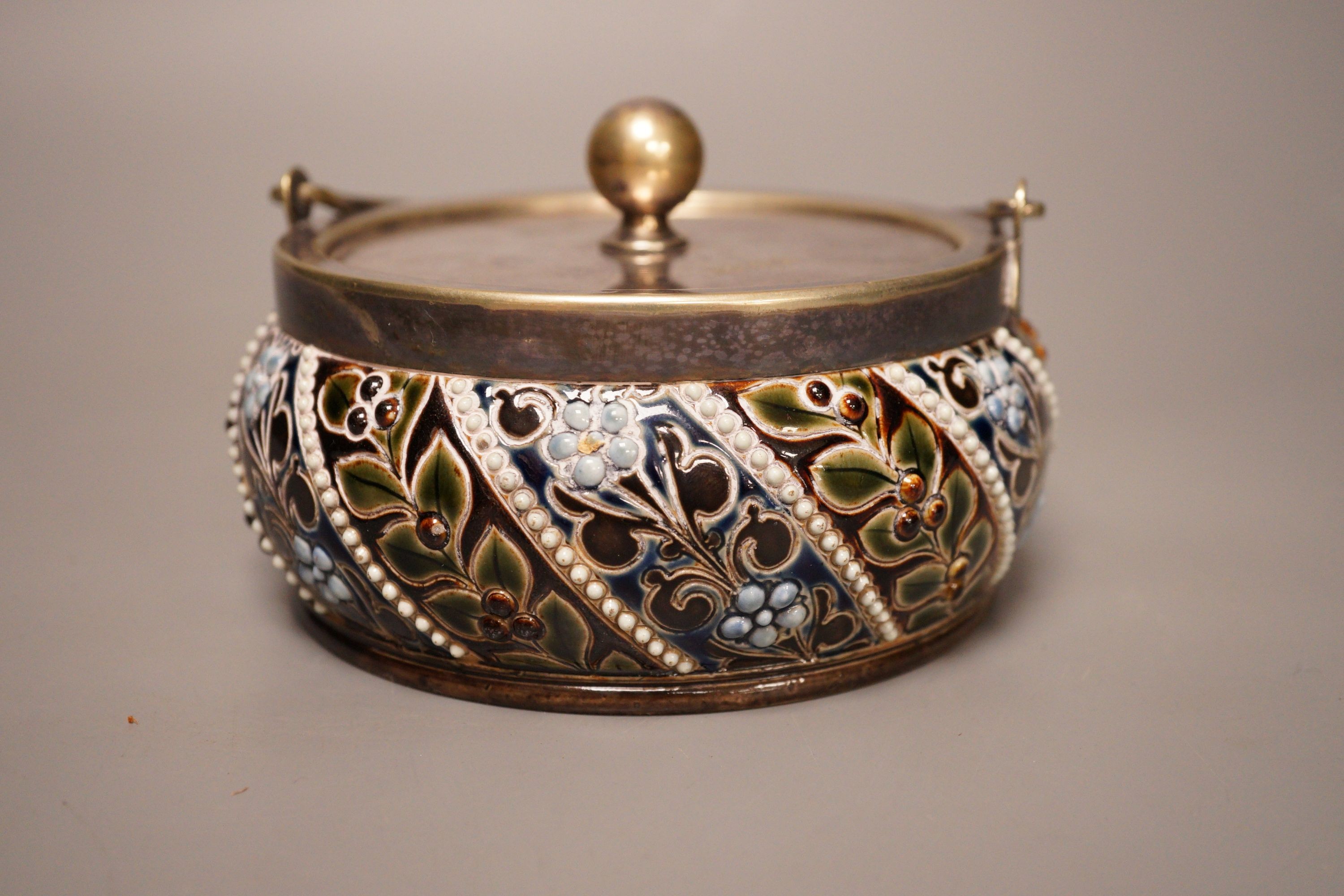 A Doulton style salt glaze stoneware lidded jar, marked HB, 8cm tall
